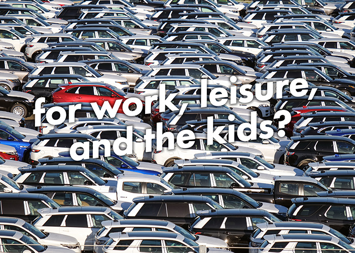 A car lot containing closely-packed and innumerable empty Sports Utility Vehicles of various colours, but mostly silver. White angled text in thet centre of the image reads 'for work, leisure, and the kids' with a question mark.